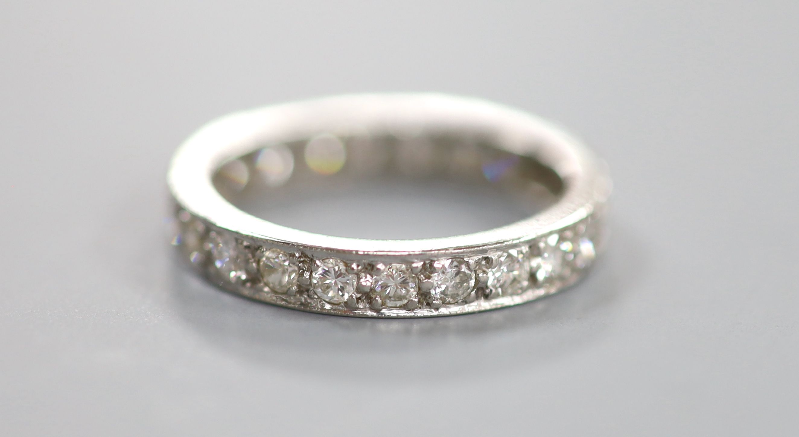 A white metal and diamond set full eternity ring